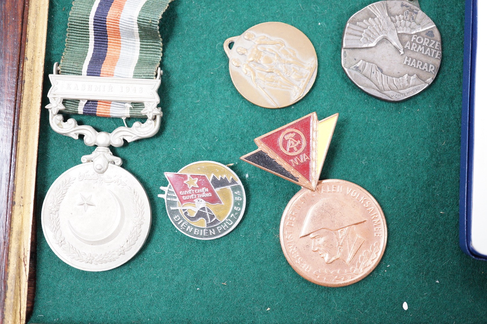 Foreign medals - Pakistan GSM with Kashmir 1948 clasp, two Liberation of Kuwait medals, Saudi Arabia and Kuwait issues, East German reserve medal, Italian Ethiopia Campaign 1937 medal, ONB badge and Combattimento medal,